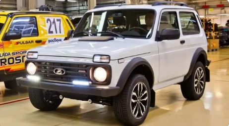The customer's uploaded photo: a white Lada Niva, front three-quarter
